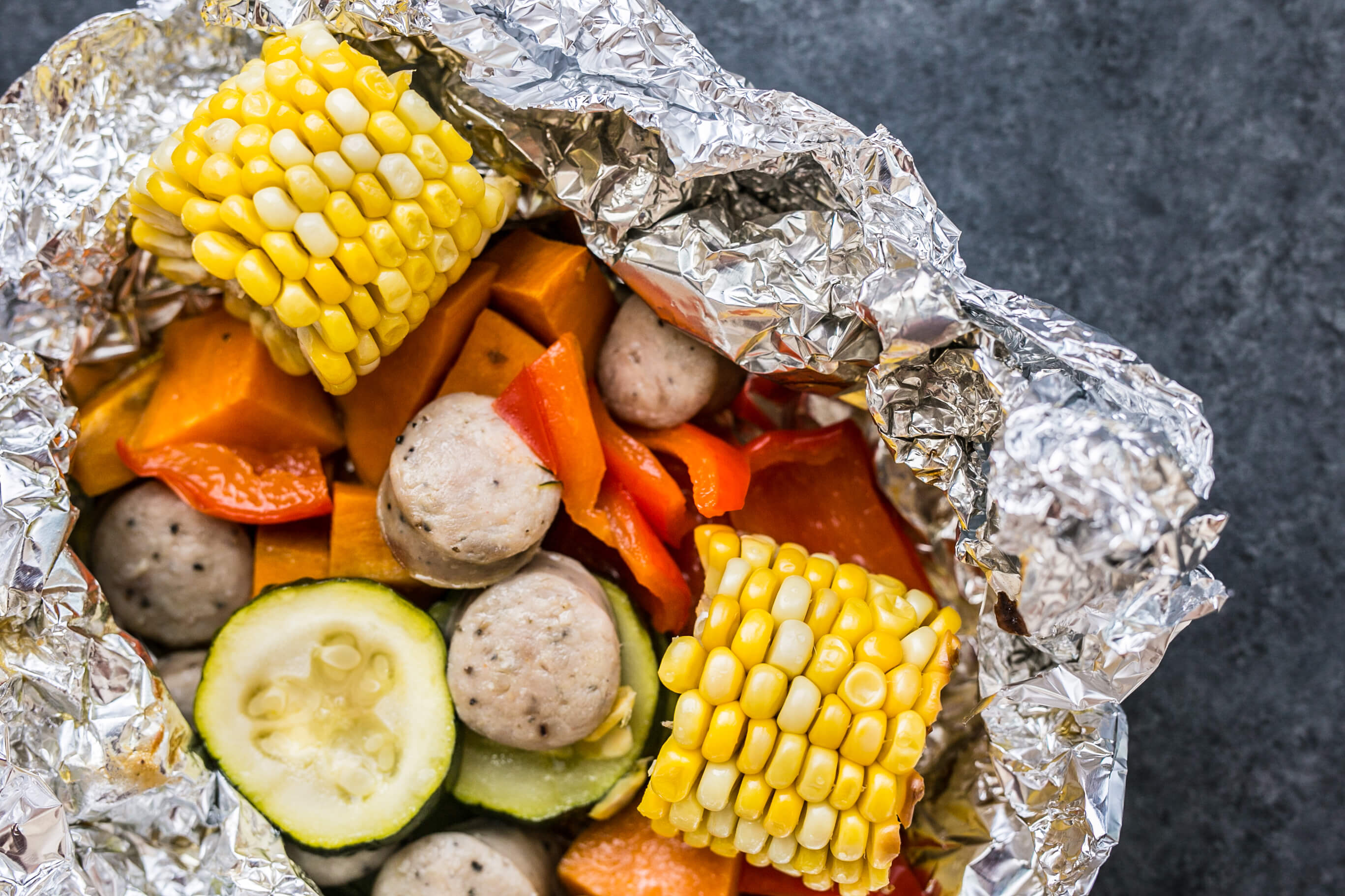 20 Summer-Inspired Meals Your Clients Will Love: Sausage & Veggie Foil Packets